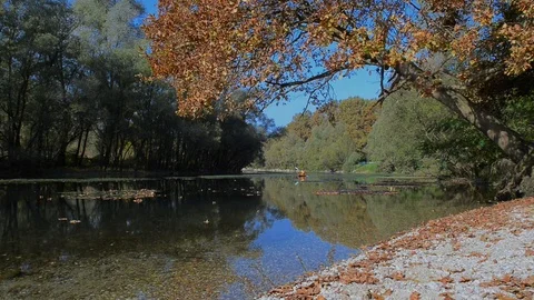 Canoeing on the river in the autumn Stock Footage