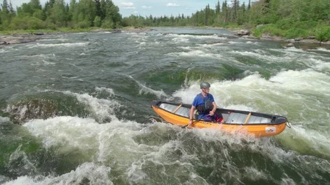 Canoeing into river rapids in real time Stock Footage 88299803