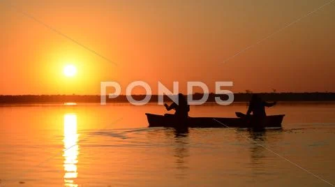 Canoeing in the sunset Stock Photos
