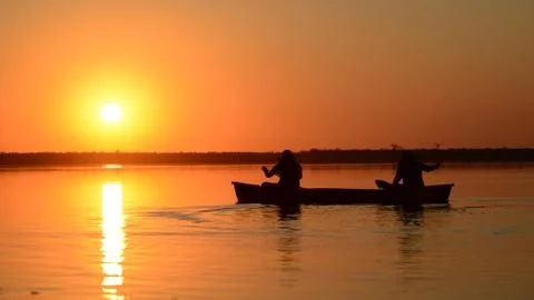 Canoeing in the sunset Stock Photos