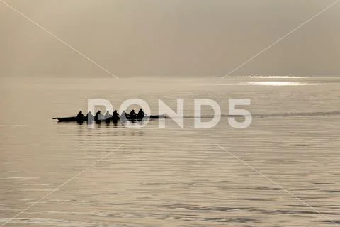 Canoeing team teamwork at water sports challenge competition. Friendship toge Stock Photos