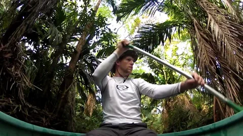 Canoeing through the jungle canals Stock Footage 27645730