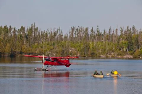 Canoeists getting picked by a float plane, Wabakimi Provincial Park, Ontario, Stock Photos