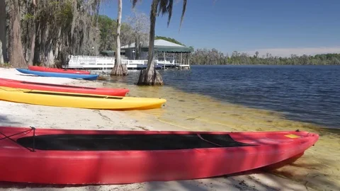 Canoes on a beach at the lake Stock Footage 76007032