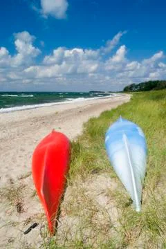 Canoes on the beach Stock Photos