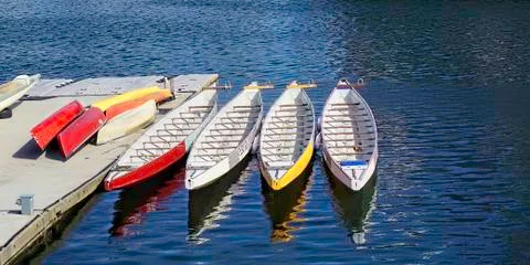 Canoes at the Dock. Stock Photos