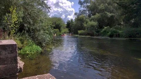 Canoes going around the corner on the stour at Westbere Stock Footage 248906137