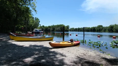 Canoes by the Lake Stock Footage 108876638
