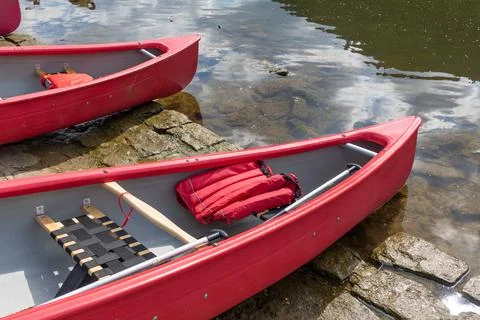 Canoes at a river Stock Photos