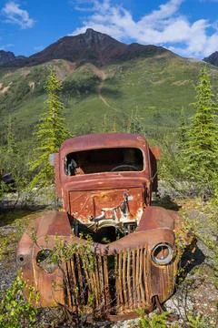 Canol road An array of abandoned rusty post war trucks that lay rusting aw... Stock Photos