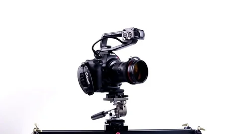 Canon C100 Camera Rig on Slider Vídeo Stock 77433109