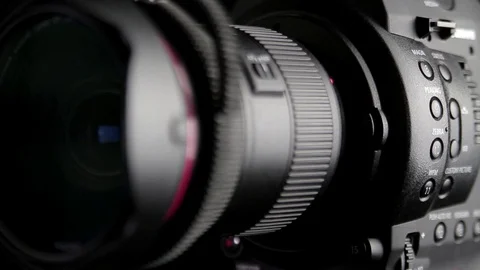 Canon C100 Camera Rotating Studio Vídeo Stock 72972810