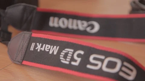 Canon EOS 5D Mark II DSLR Camera Neck Strap Close-Up Stock Footage 101604748