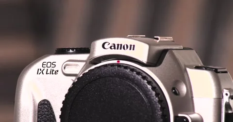 Canon EOS IX Lite Film EF mount Turntable battery Disposal Old Technology Stock Footage 244654792