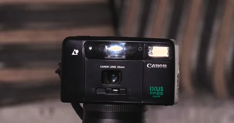 Canon IXUS FF25 date Turntable battery Disposal Old Technology 25mm build Stock Footage 244654837