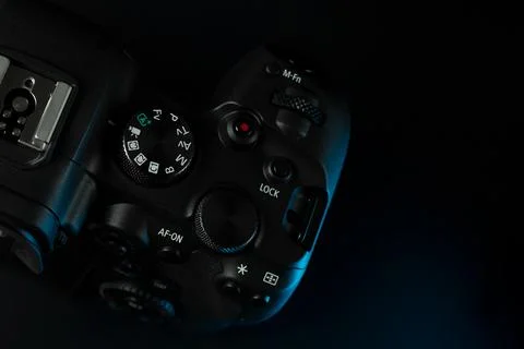 Canon r6 digital camera close-up, black background, glare Stock Photos