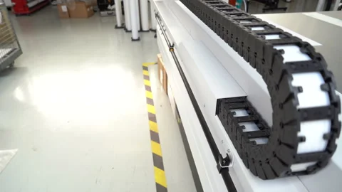 Canon UV Flatbed Printer - detail shot of the flex cable drag chain Stock Footage 224930455