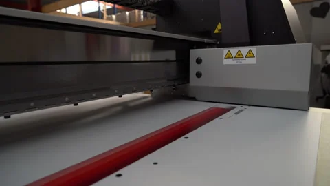 Canon UV Flatbed Printer - following the print head in close-up Stock Footage 224930344