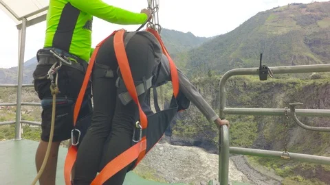 Canopy Guide Tying Up A Tourist To Wire Stock Footage 88337720