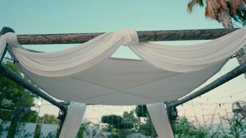 A canopy stands under the sky in an event garden in the evening. Stock Footage 242015979