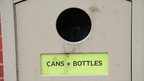 Cans bottles words writing caption text light brown public disposal recycle Stock Footage 249754616