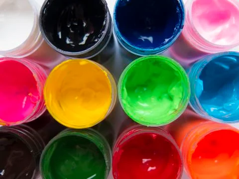 Cans of colored paint Stock Photos