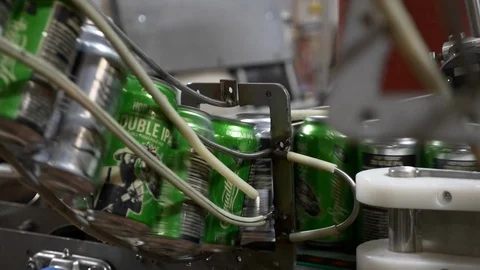 Cans of microbrew beer pass on processing assembly line. Stock Footage 100650448