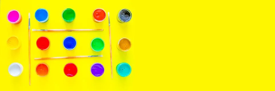 Cans of multi-colored paint all over the image Stock Photos