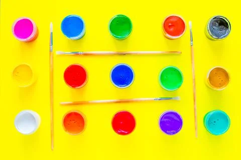 Cans of multi-colored paint all over the image Stock Photos