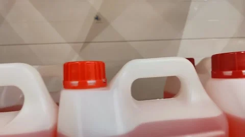 Cans of red liquid on display. Stock Footage 220606188