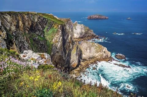 Cantabrian Sea coastline with high dramatic cliffs in Asturias Stock Photos