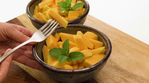 Cantaloupe melon bite-sized cubes close up in a bowls. Stock Footage 160265932