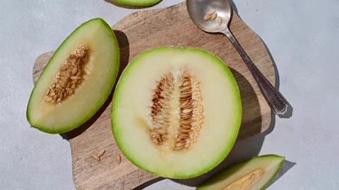 Cantaloupe, melon fruit slice over bright background. Stock Footage 236404492