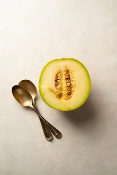 Cantaloupe, melon fruit slice over bright background. Stock Photos