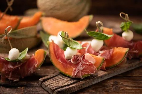Cantaloupe melon with prosciutto Stock Photos