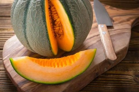Cantaloupe melon on wooden background Stock Photos