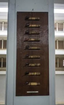 Canting made from bamboo for drawing Batik pattern displayed on wood frame photo Stock Photos