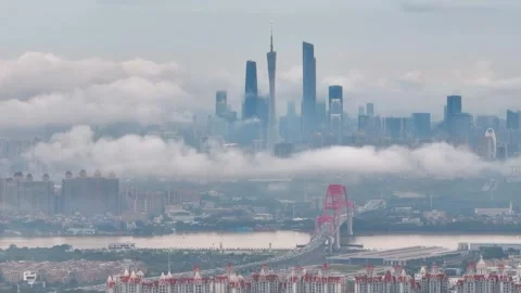 Canton Tower skyline beyond bridge and cloud bands in Guangzhou China Stock-Footage 345960467