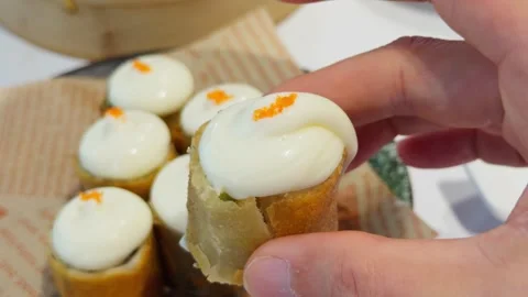Cantonese Cheese Avocado Roll Dim Sum Held by Hand Close-Up Stock Footage 339399309