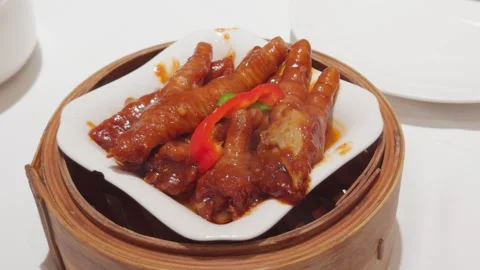 Cantonese Dim Sum Chicken Feet in Bamboo Steamer Handheld Slow Pan Shot Stock Footage 339399654