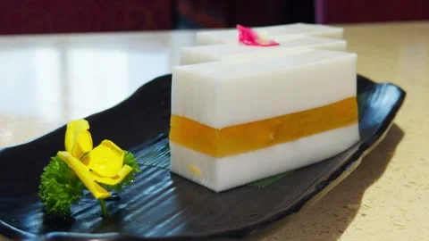 Cantonese Mango Coconut Milk Cake Layered Dessert Handheld Slow Pan Shot Stock Footage 339399323