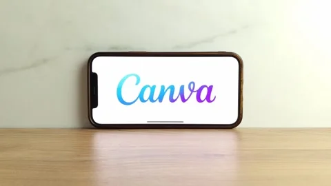 Canva logo displayed on mobile phone Stock Footage 244079786