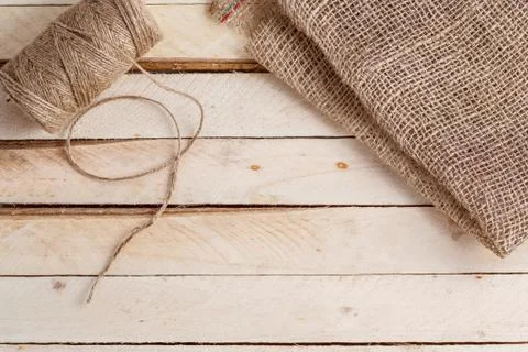 The canvas and the tangle of thread on a wooden background Stock Photos