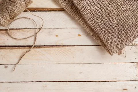 The canvas and the tangle of thread on a wooden background Stock Photos