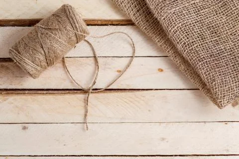 The canvas and the tangle of thread on a wooden background Stock Photos