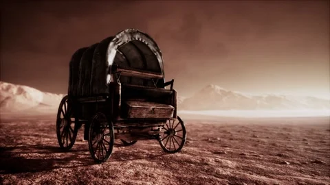 Canvas covered retro wagon in desert at sunset Stock Footage 129880182