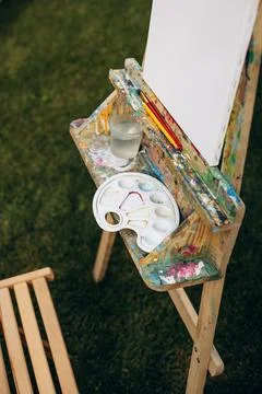Canvas with paints outside in park Stock Photos