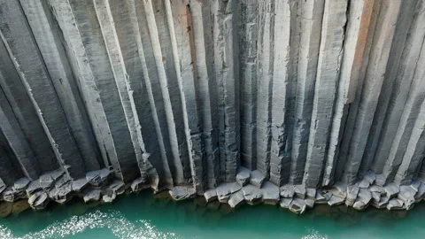 Canyon of basalt columns, cliff with turquoise river, in Iceland, aerial shot Stock Footage 262464090
