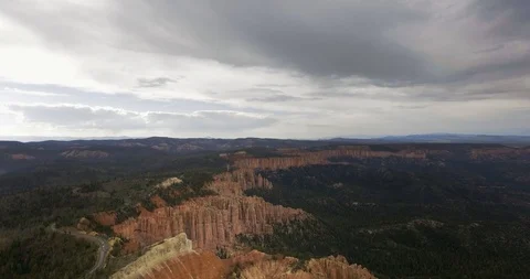Canyon with dark pine forest and highway on a cloudy day Video stock 118643486