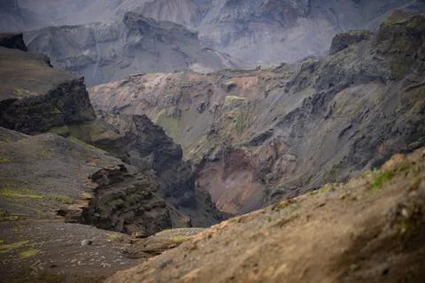 Canyon with different colored layers cliffs and hills Stock Photos